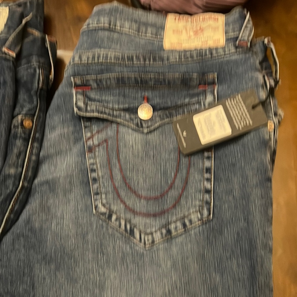 Brand New with tags True Religion men jean pants and two gently used.